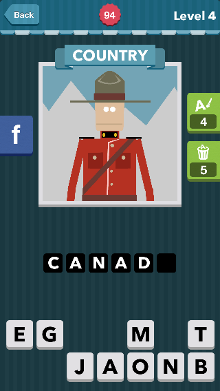 Man in red patrol clothes with brown hat in front of mountain
