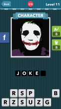 A person wearing white face paint with no eyes, green hair an