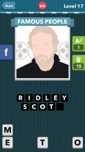 A man with a white beard and white hair and a black shirt on|